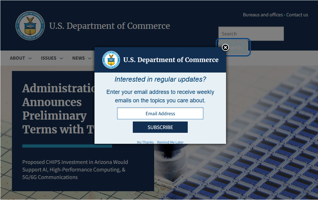 A dialog box asking “Interested in regular updates?” hides part of a focus indicator and the site navigation menu on the web page beneath it.