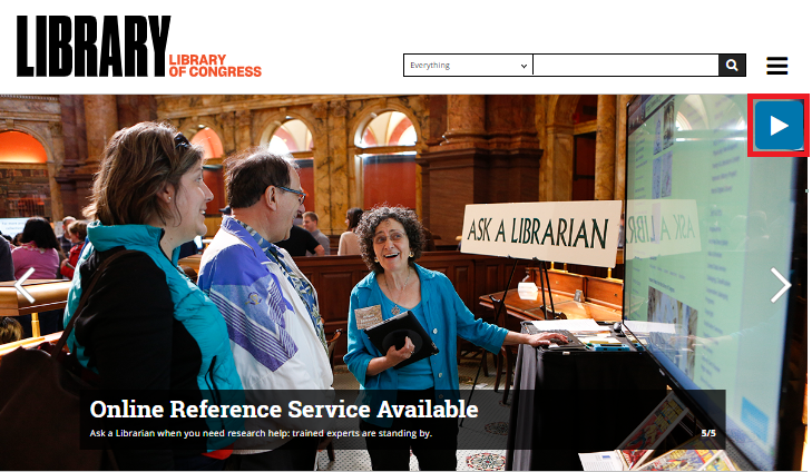 Carousel with the current slide advertising "Online Reference Service Available". The slide shows a woman in front of a large digital display talking to another woman and a man. A sign next to the first woman says, "Ask a Librarian". There is a start button in the top-right corner of the carousel, a previous button on the left, and a next button on the right.